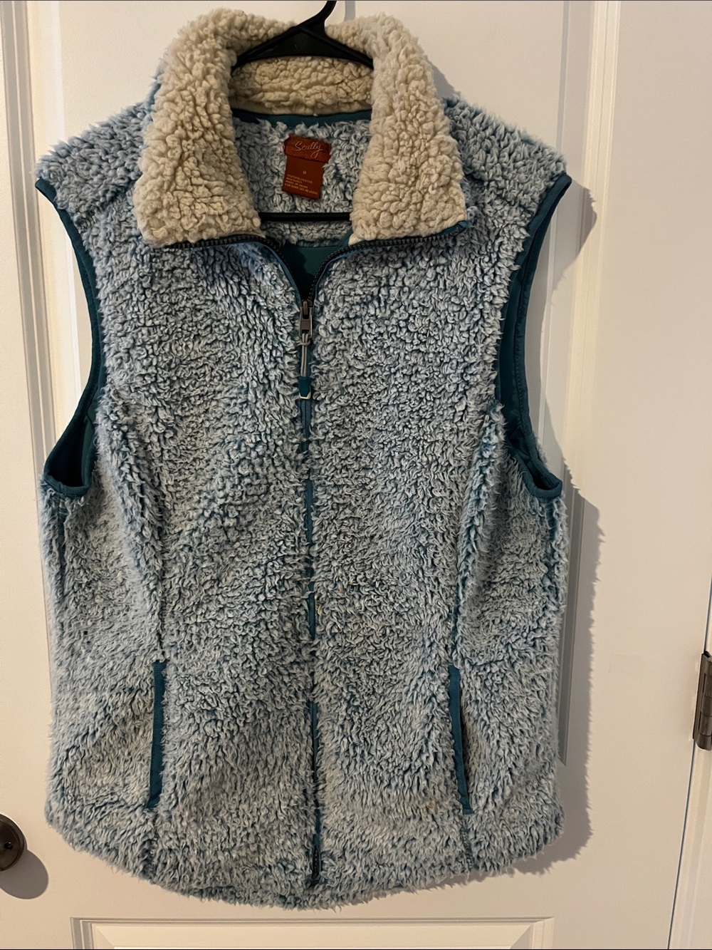Scully Light Blue zipper Sherpa Vest with Cream Collar pockets on each side.